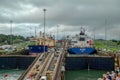 A cruise ship with the passengers on the bow watching ships going through the Panama Canal Royalty Free Stock Photo