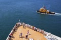 Cruise ship passengers on the deck arriving in Caribbean port