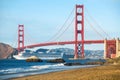 Cruise ship passing Golden Gate Bridge with the skyline of San Francisco in the background, California, USA Royalty Free Stock Photo