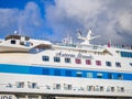 Cruise ship at the pier. Huge ship on the pier. Astoria Grande. Vacation on a cruise. At the parking lot. Expensive trip. Royalty Free Stock Photo