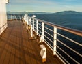 Cruise ship Port deck and railing in late afternoon, Inside Passage, BC, Canada.