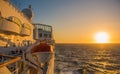 Cruise ship sailing in sunset on Atlantic Ocean Royalty Free Stock Photo