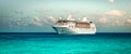 Cruise ship sailing on the Caribbean Sea. Side view of the vessel. Wide image.