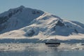 Cruise ship sailing in front of Antarctic mountains, Paradise Bay,