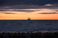 Cruise ship sailing at the horizon on the Baltic Sea after sunset, beautiful dramatic colors Royalty Free Stock Photo