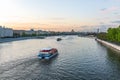 Cruise ship sails on the Moscow river in Moscow city center, popular place for walking