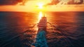 A cruise ship sails in the vast ocean, illuminated by the golden hues of a sunset, creating a beautiful silhouette against the Royalty Free Stock Photo