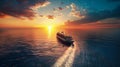 A cruise ship sails in the vast ocean, illuminated by the golden hues of a sunset, creating a beautiful silhouette against the Royalty Free Stock Photo