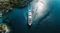 A cruise ship is seen sailing in the water of a tropical bay from an overhead perspective Royalty Free Stock Photo