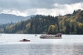 Cruise ship and speedboat on lake Royalty Free Stock Photo