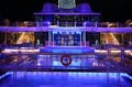 Cruise ship swimming pool at night on the top deck with scenic views Royalty Free Stock Photo