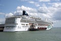 Cruise ship taking on fuel with bunkering vessel alongside