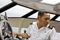 Cruise ship tender pilot manoeuvring boat. Royalty Free Stock Photo