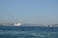 Cruise ship and traditional Istanbul ferry boat with Bosporus bridge, Istanbul, Turkey