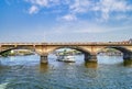 Cruise ship under the bridge on the Vltava river. Prague, Czech Republic.