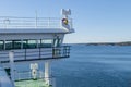 Cruise ship white cabin with big windows. Wing of running bridge of cruise liner. White cruise ship on a blue sky with radar and