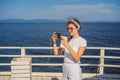 Cruise ship woman using mobile phone on travel vacation at ocean. Girl texting sms on wifi on tropical holidays Royalty Free Stock Photo