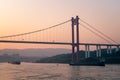 Cargo ships on the Yangtze River under the shining glow of the sunrise passes Cuntan Port