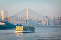 A cruise ship on the Yangtze River under the shining glow of the sunrise passes Cuntan Port Royalty Free Stock Photo