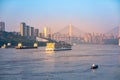 A cruise ship on the Yangtze River under the shining glow of the sunrise passes Cuntan Port Royalty Free Stock Photo