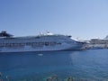 Cruise ship in the large Harbour by the old walled Town of Rhodes in the Greek Islands