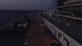 Cruise ships and cars at sea port at night. Royalty Free Stock Photo
