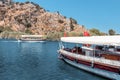 Ferry boats with Turkish flags transport tourists to the natural wonder of Mediterranean Turkey - the Dalyan