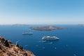 Cruise ships are staying moored in volcanic caldera of Santorini island, Greece Royalty Free Stock Photo