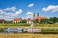 Cruise ships on the Warta River and the bell towers of the historic cathedral Royalty Free Stock Photo