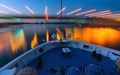 Cruise steamboat under the bridge at sunset, long exposure