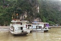 Cruise stop and waiting for tourists at the bay of Thien Cung Cave with in summer at Ha Long Bay. Quang Ninh, Vietnam