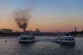 Cruise tour on the Moskva river, fire with smoke in the city centre of Moscow.