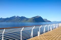 Cruise towards Geiranger fjord on a beautiful day with views of the mountains from the open deck of the ship, Norway