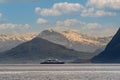 Cruise vessel inside the fjord of Norway with snow capped m