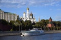 A cruise yacht sails along Moscow Kremlin. Color photo.