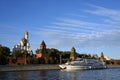 A cruise yacht sails along Moscow Kremlin. Color photo.