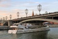 A cruise yasht of Radisson Royal sails under the Big Stone Bridge in Moscow Royalty Free Stock Photo