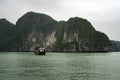 Cruising among beautiful limestone rocks and secluded beaches in Ha Long bay, UNESCO world heritage site