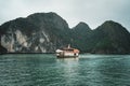 Cruising among beautiful limestone rocks and secluded beaches in Ha Long bay, UNESCO world heritage site