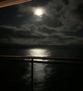 Cruising by moonlight reflected in the sea