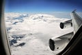 Cruising over clouds, side window view over the wing of the Boeing 747 jet airplane..Santiago, Chile - 05/11/2017