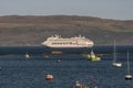 Cruising through the Scottish isles. Cruise ship at anchor at Portree, Scotland.