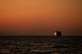 Cruising ship silhouette on Aegean sea in Greece at sunset