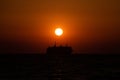 Cruising ship silhouette on Aegean sea in Greece at sunset