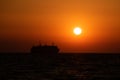 Cruising ship silhouette on Aegean sea in Greece at sunset