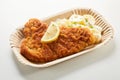 Crumbed portion of takeaway fish or schnitzel