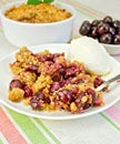 Crumble cherry with berries on plate Royalty Free Stock Photo