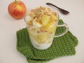 Crumble mug cake with apple, yogurt cookie crumbs and almond brittle Royalty Free Stock Photo