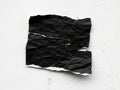 Crumbled black paper texture isolated on for creative design projects Royalty Free Stock Photo