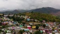 Aerial establishing shot drone footage of colorful mountain village following an earthquake. Cinematic 4K footage.